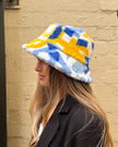 Cinnamon Creations Faux Fur Bucket Hat Light Blue/Yellow