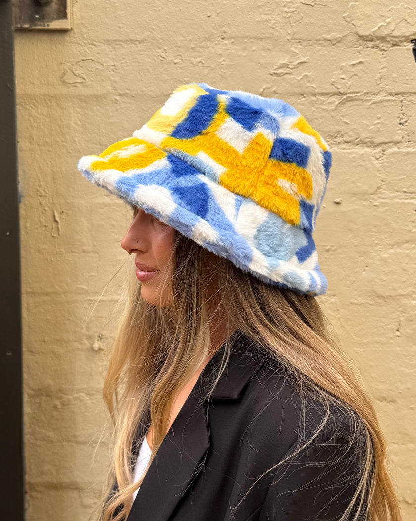 Cinnamon Creations Faux Fur Bucket Hat Light Blue/Yellow