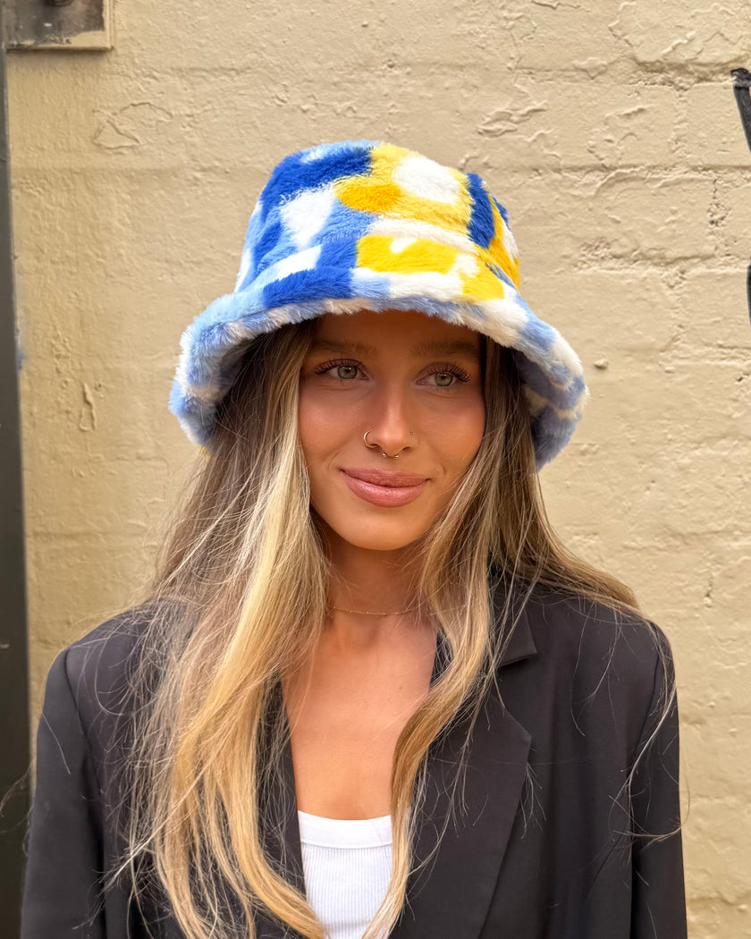 Cinnamon Creations Faux Fur Bucket Hat Light Blue/Yellow